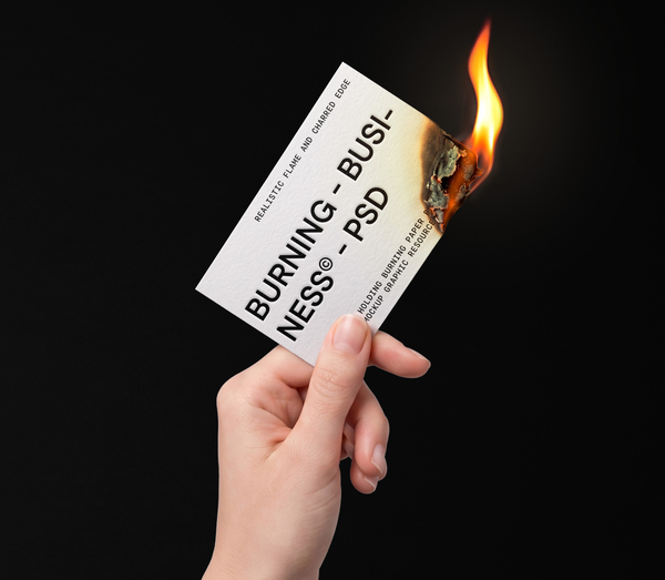 Hand Holding Burning Paper Business Card PSD Mockup
