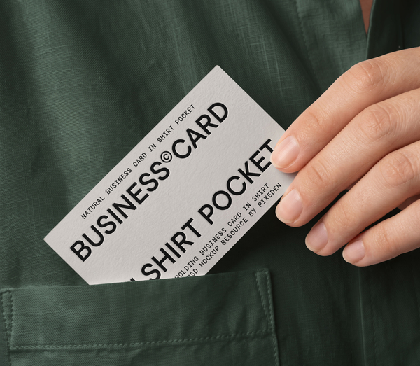 Hand Holding Business Card in Shirt Pocket PSD Mockup