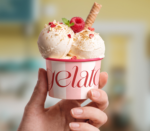 Hand Holding Gourmet Ice Cream Paper Cup PSD Mockup