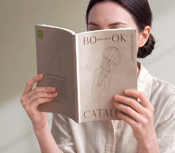 Hands Holding Open Softcover Book Mockup PSD - Minimalist Editorial Scene