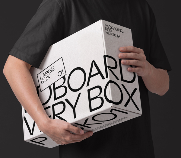 Holding Large Cardboard Delivery Box Packaging PSD Mockup